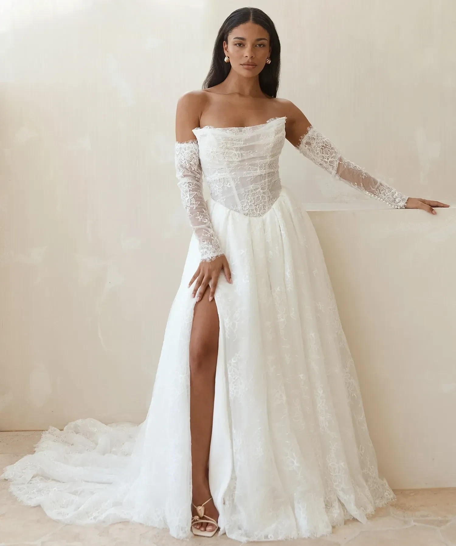 Model wearing a white gown by Madi lane