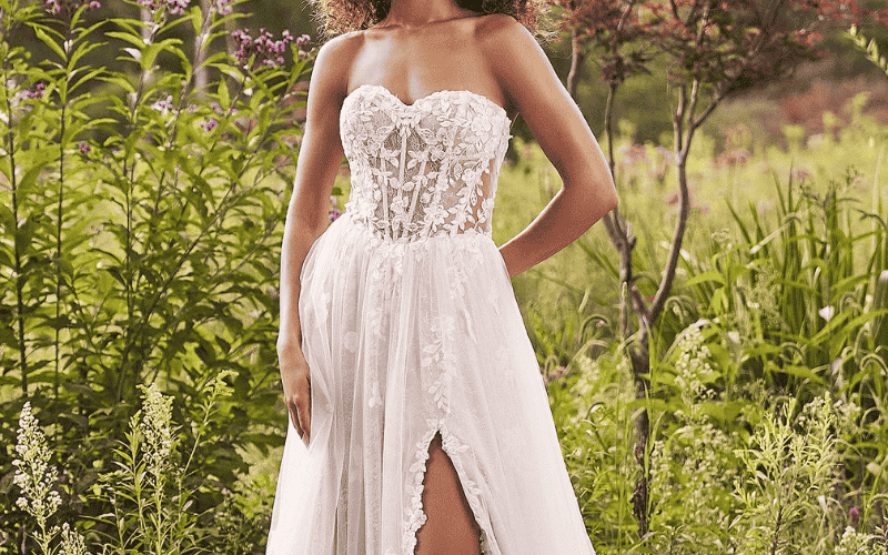 bride wearing a second wedding dress with a corset and high slit