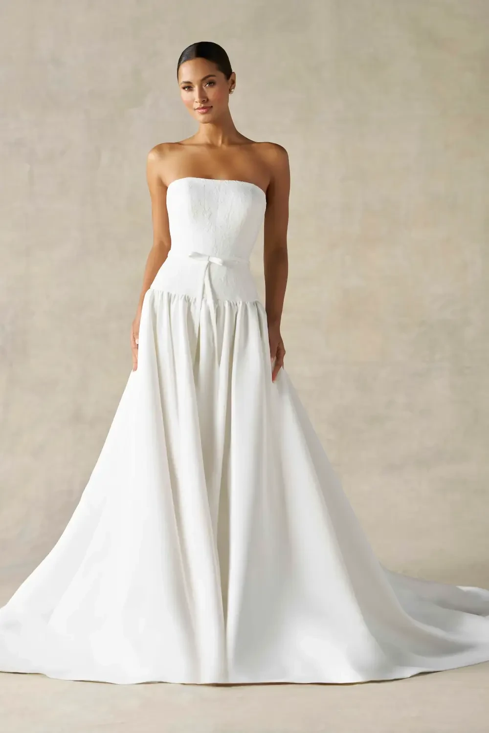model is wearing a strapless bridal gown