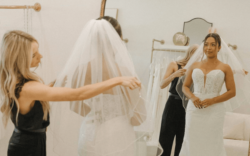 A babe stylist with a bride to be at her appointment