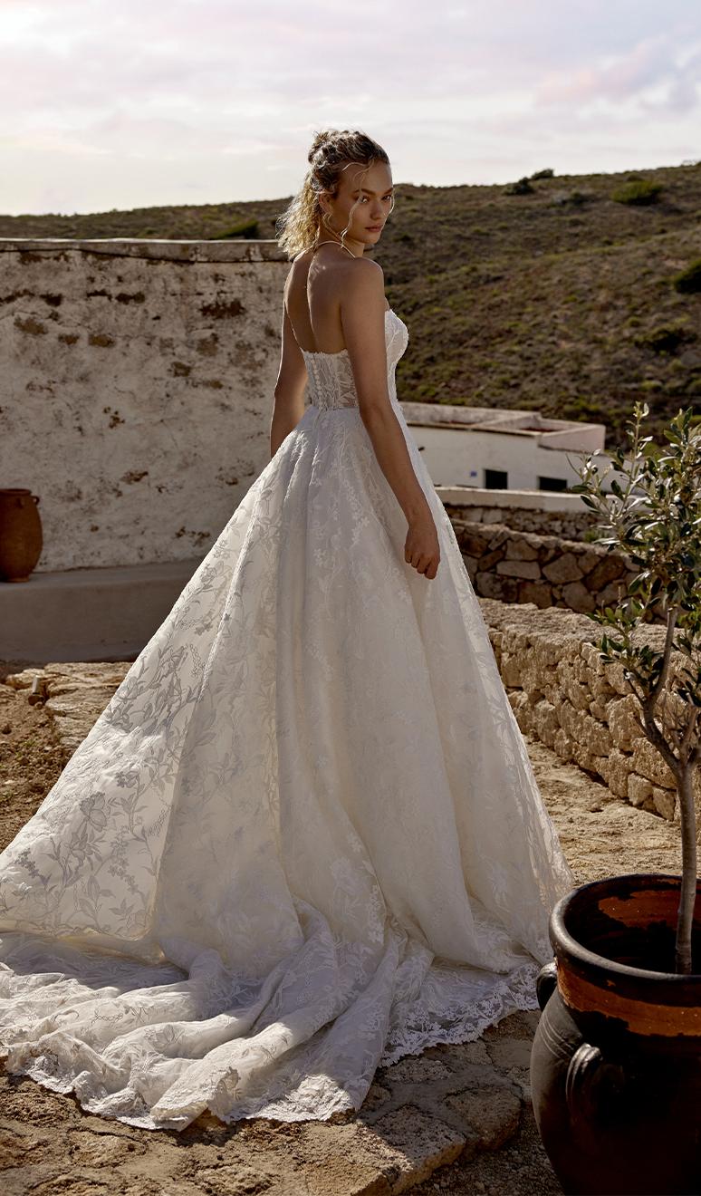 Model wearing a white gown by Lillian West