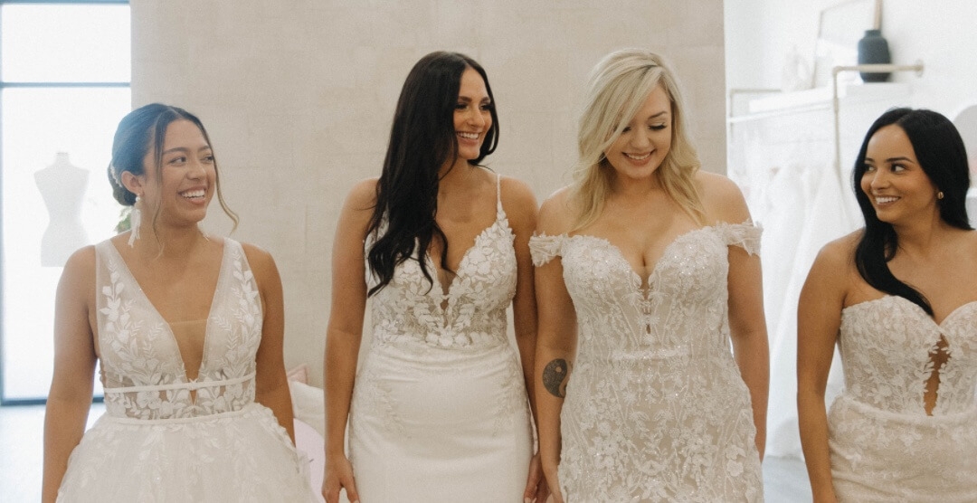 Models wearing a white gowns